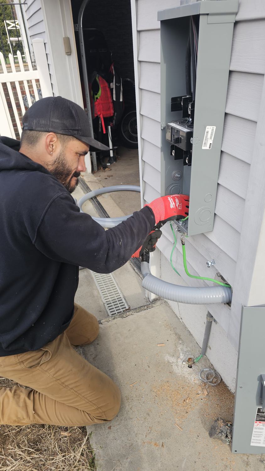 Darwin, founder of Empire SolarGrid LLC, working on site at a job